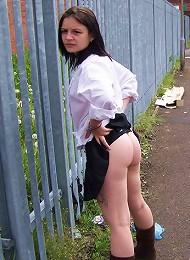 Sweet brunette naked in the street
